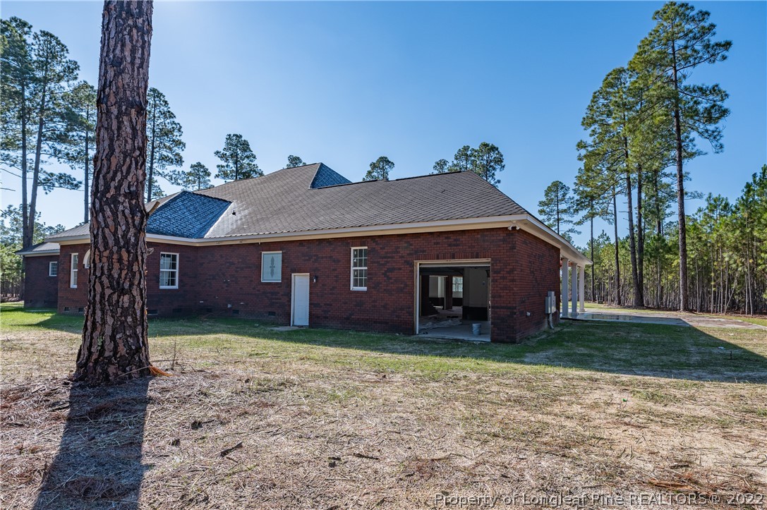 193 Kirk Road Aberdeen, NC 28315 - Photo 47 of 49 a front view of a house with yard and trees