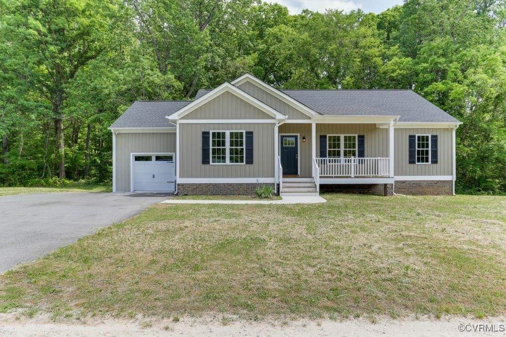 10907 New Town Road New Kent, VA 23124 - Photo 1 of 30 Ranch-style home featuring a porch, an attached ga