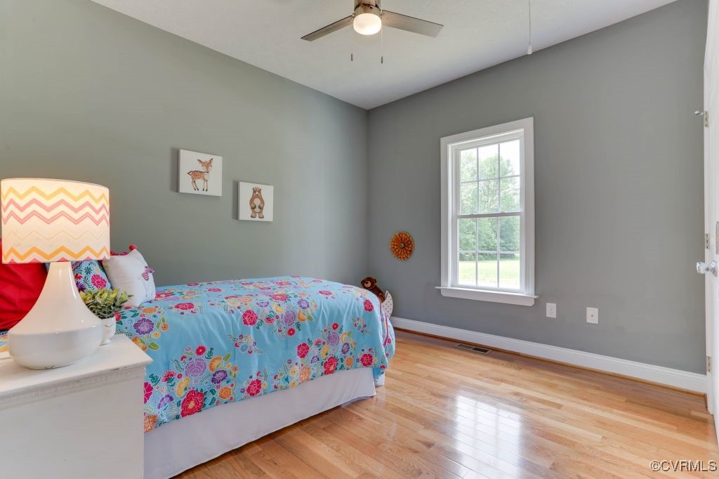 10907 New Town Road New Kent, VA 23124 - Photo 24 of 30 Bedroom featuring wood finished floors, baseboards