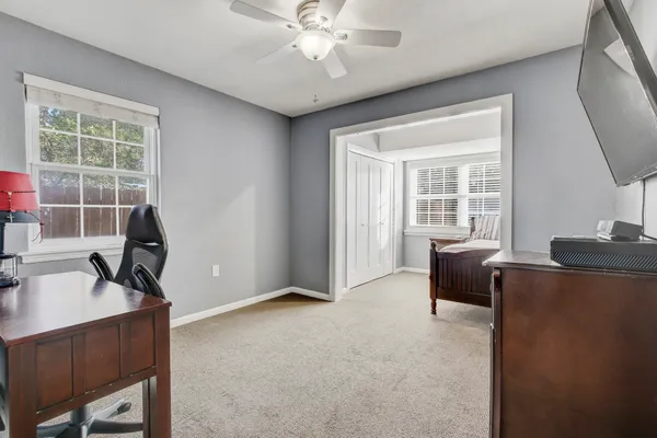 a bed room with a bed and a television