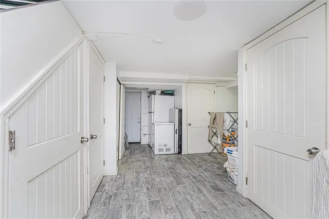 a view of a room with wooden floor and closet