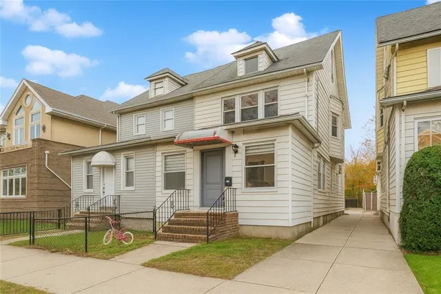 a view of a house with a bench
