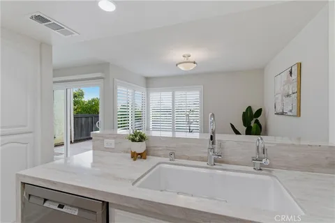 a bathroom with a sink and a window