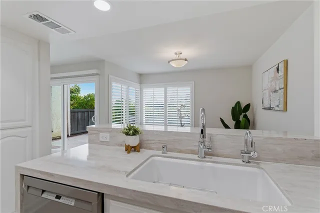 a bathroom with a sink and a window