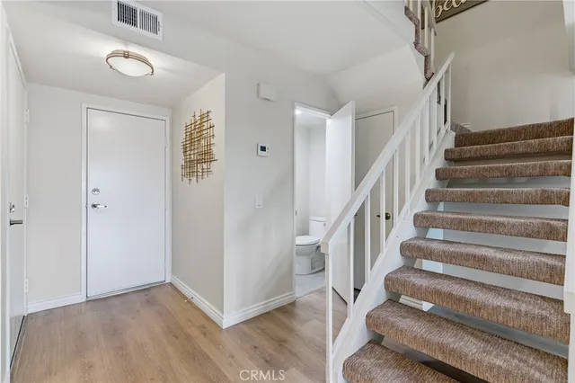 a view of entryway with wooden floor