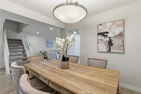 a dining room with table and chairs