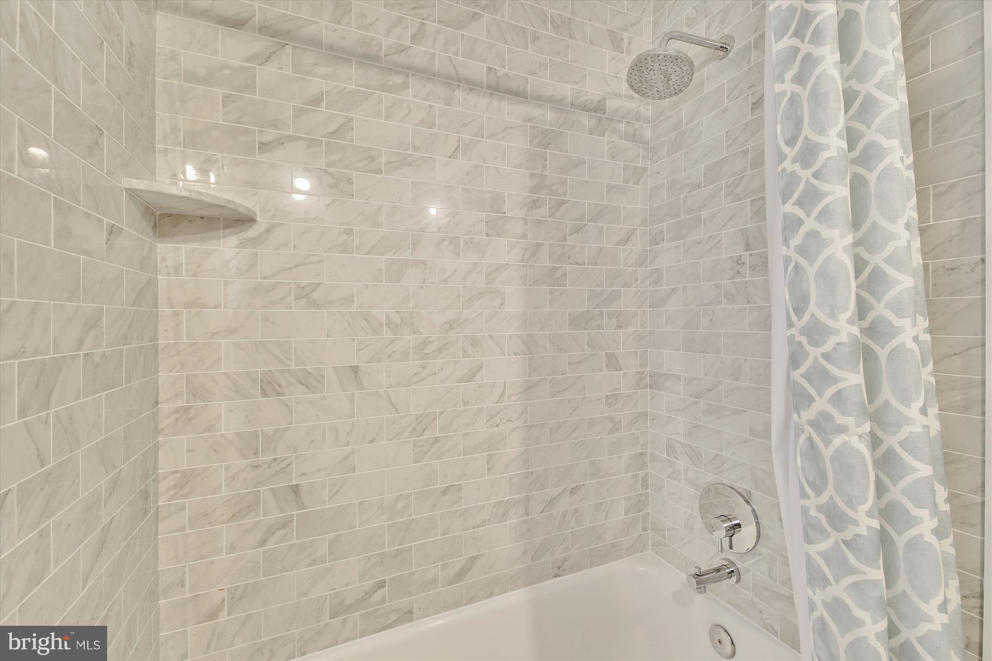 6121 Ramsgate Road Bethesda, MD 20816 - Photo 22 of 30 Gorgeous Carrera-style tile in updated bathroom