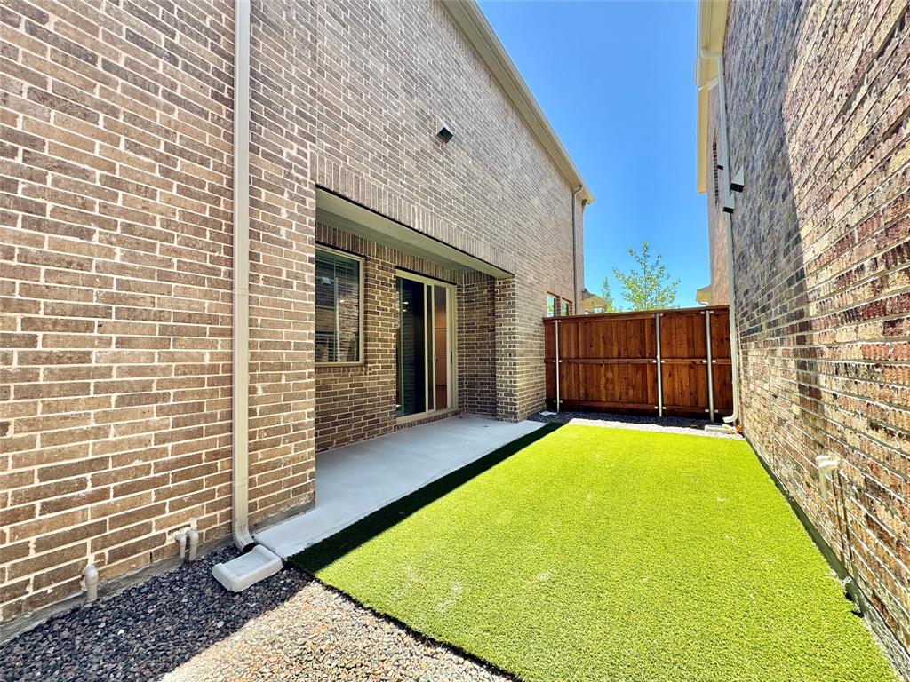 8509 Shorehan Road The Colony, TX 75056 - Photo 13 of 33 View of yard with fence and a patio area