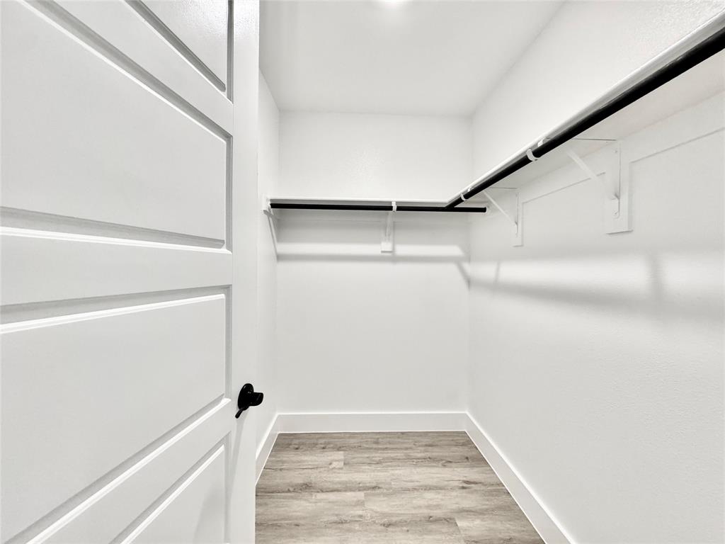 8509 Shorehan Road The Colony, TX 75056 - Photo 28 of 33 Walk in closet with light wood-style floors