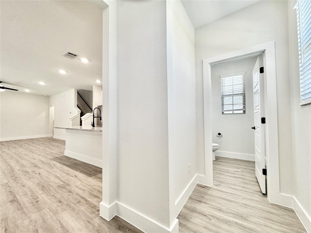 8509 Shorehan Road The Colony, TX 75056 - Photo 5 of 33 Hall with light wood finished floors, baseboards, and recessed lighting
