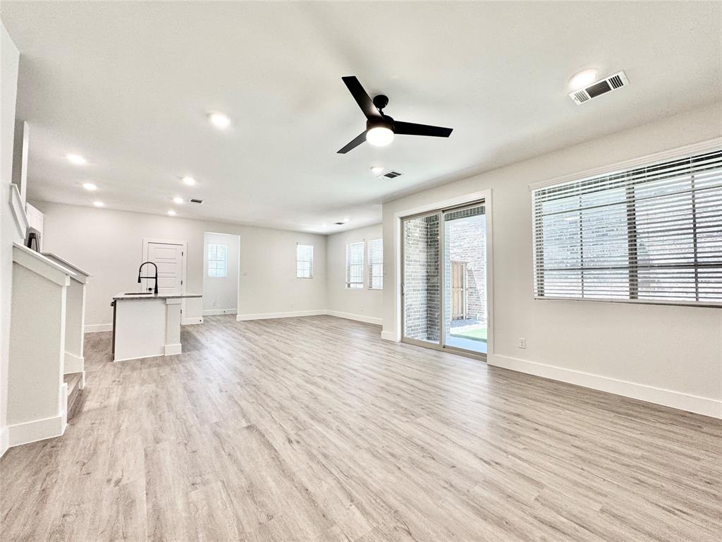 8509 Shorehan Road The Colony, TX 75056 - Photo 8 of 33 Unfurnished living room featuring a sink, light wood finished floors, ceiling fan, baseboards, and recessed lighting