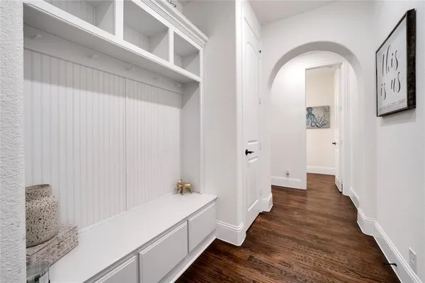 a hallway with wooden floor