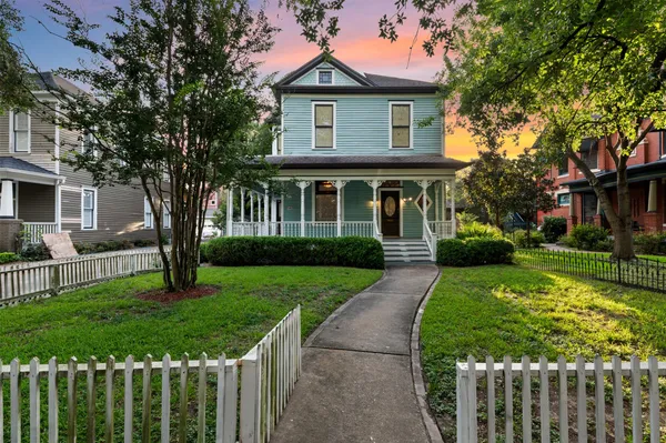 a front view of a house with yard