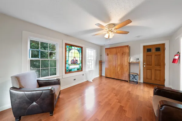 a view of entryway with wooden floor and stairs