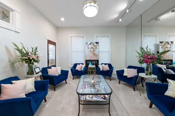 a bathroom with a granite countertop toilet and a shower