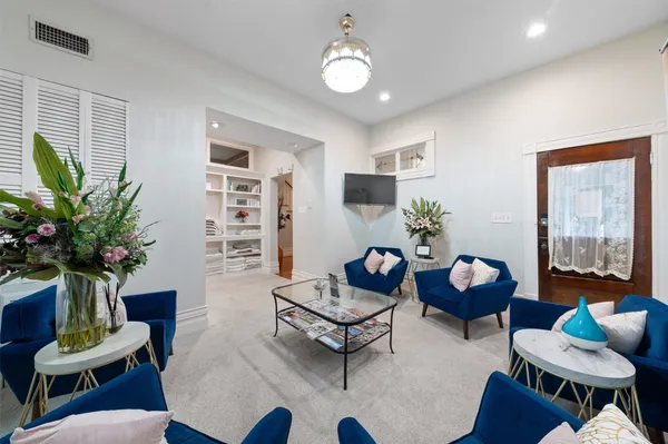 a bed room with a bed and a television