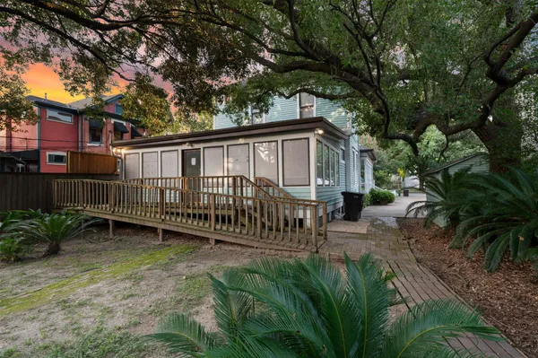 a view of a house with a yard and sitting area