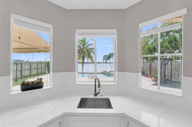 a kitchen with a sink and a window