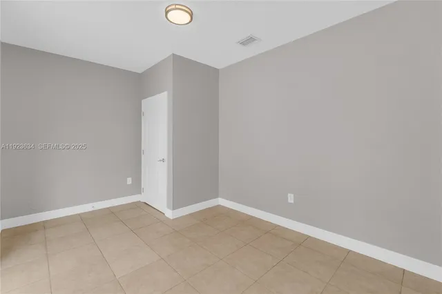 a view of a hallway with a white walls