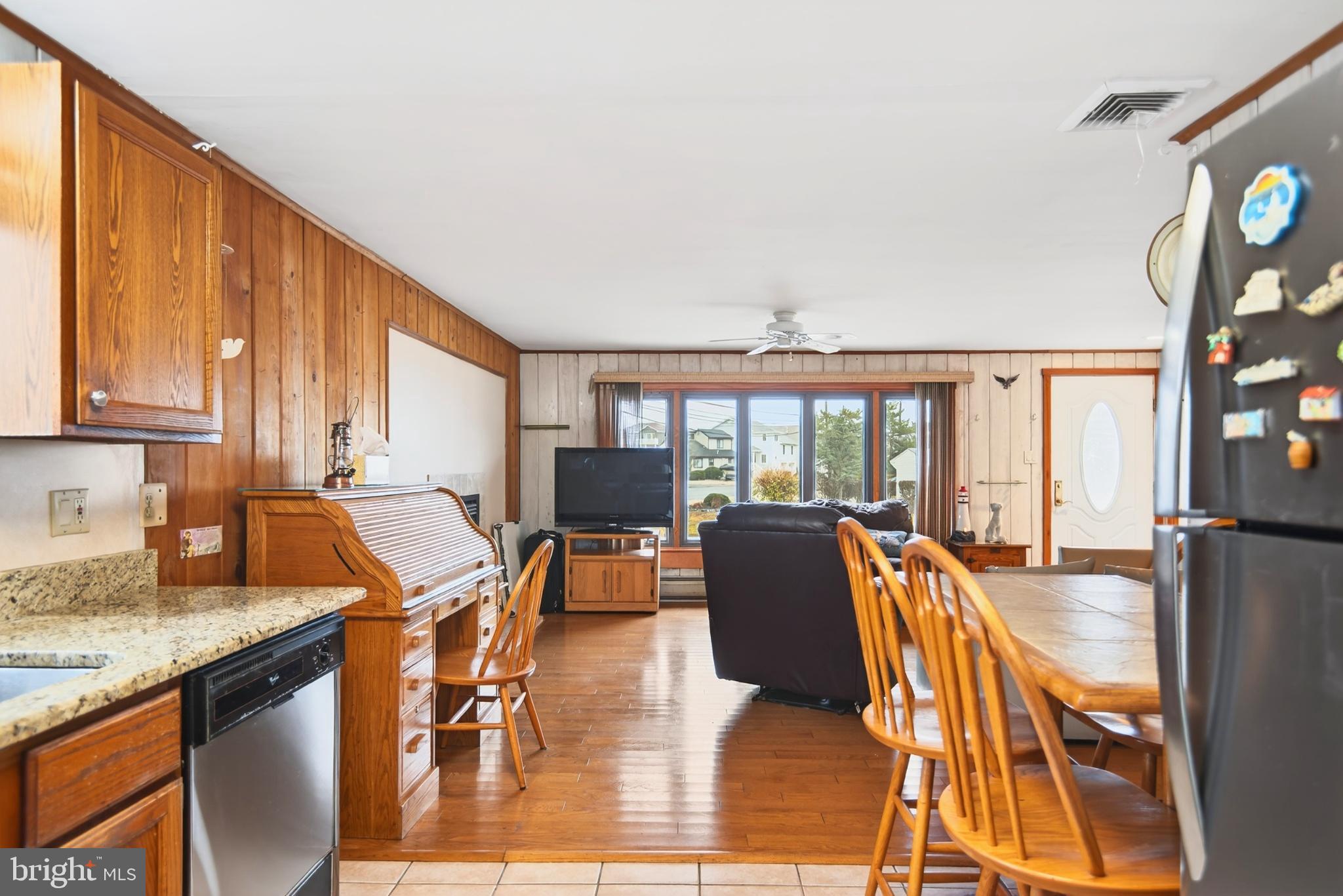 4 Rona Lane Manahawkin, NJ 08050 - Photo 12 of 28 a living room with furniture a floor to ceiling window and wooden floor