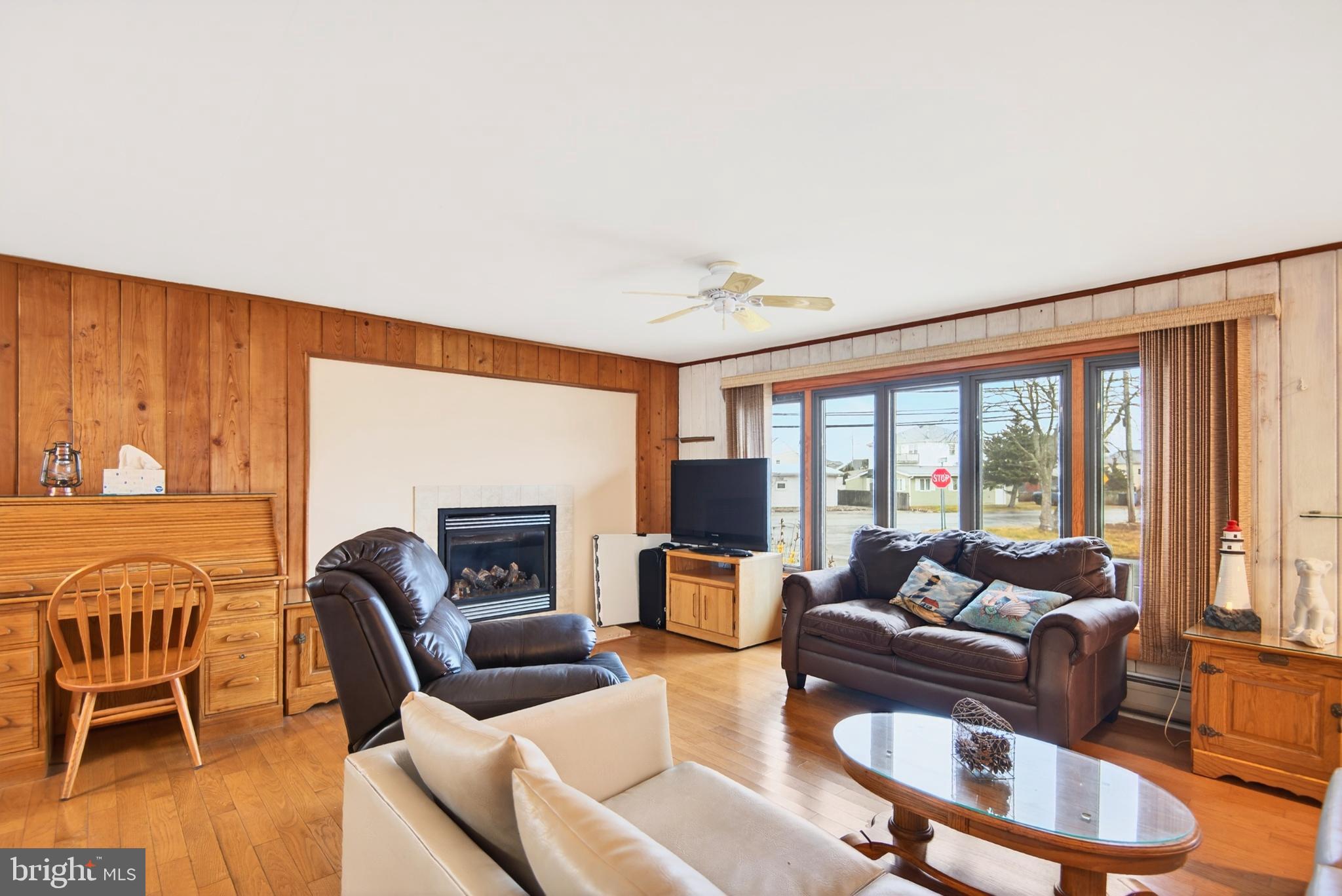 4 Rona Lane Manahawkin, NJ 08050 - Photo 13 of 28 a living room with furniture and a fireplace