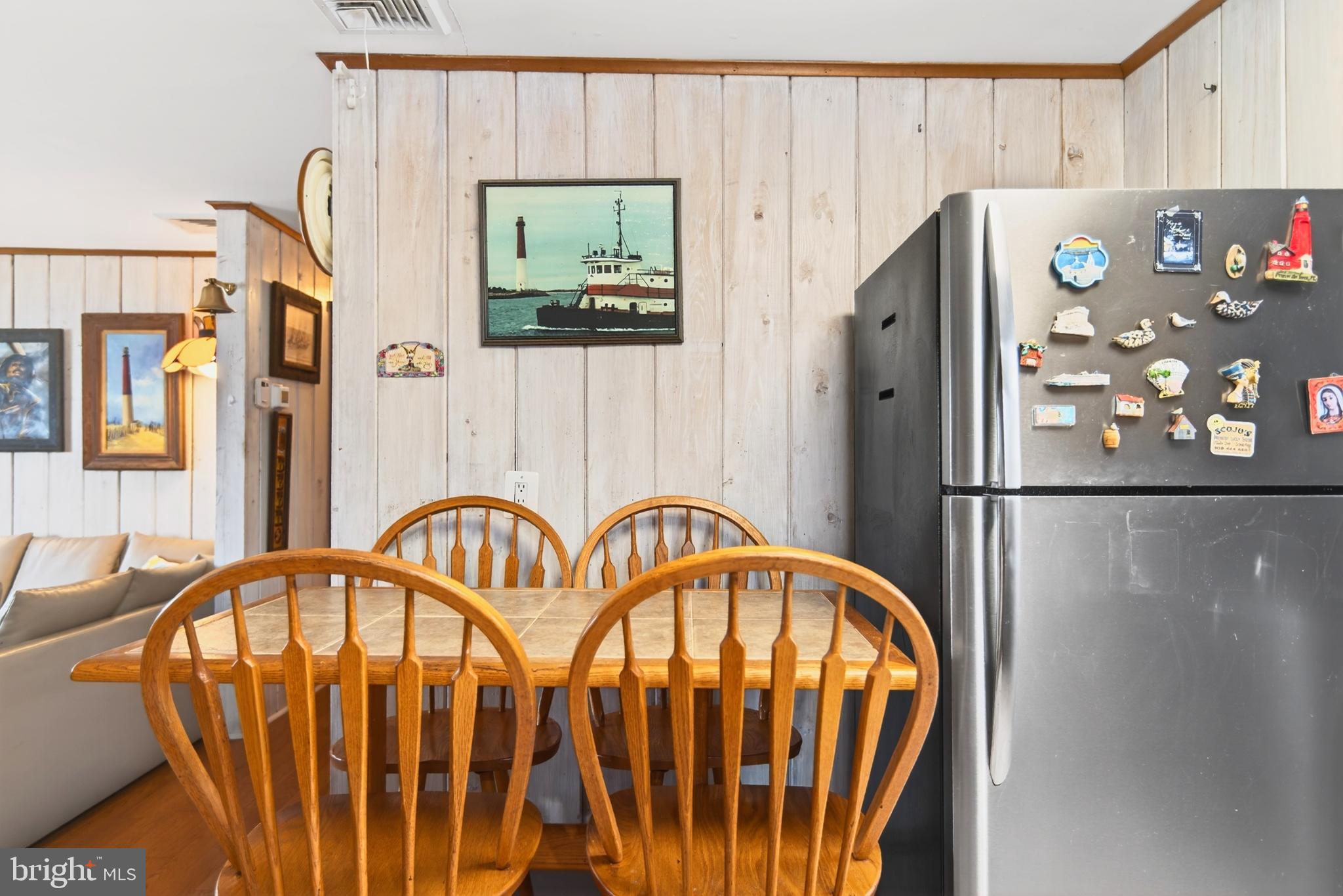 4 Rona Lane Manahawkin, NJ 08050 - Photo 14 of 28 a kitchen with stainless steel appliances granite countertop a refrigerator and a dining table