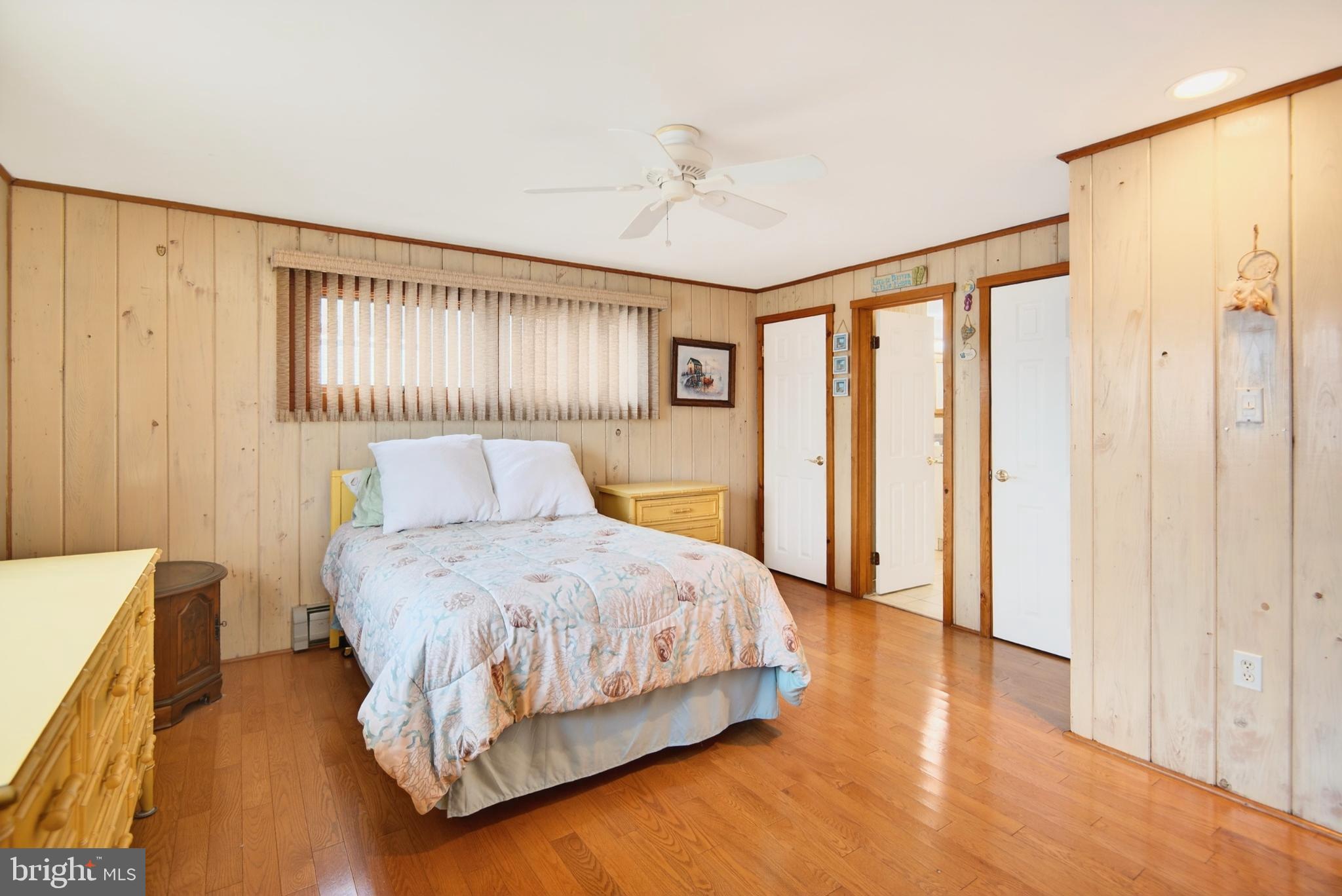4 Rona Lane Manahawkin, NJ 08050 - Photo 17 of 28 a bedroom with a bed and a dresser with wooden floor