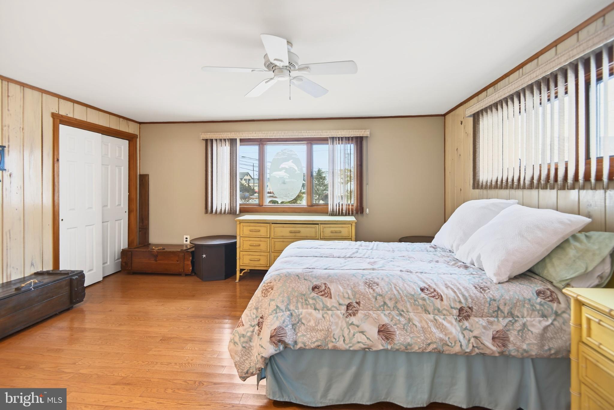 4 Rona Lane Manahawkin, NJ 08050 - Photo 19 of 28 a bedroom with a large bed and a large window