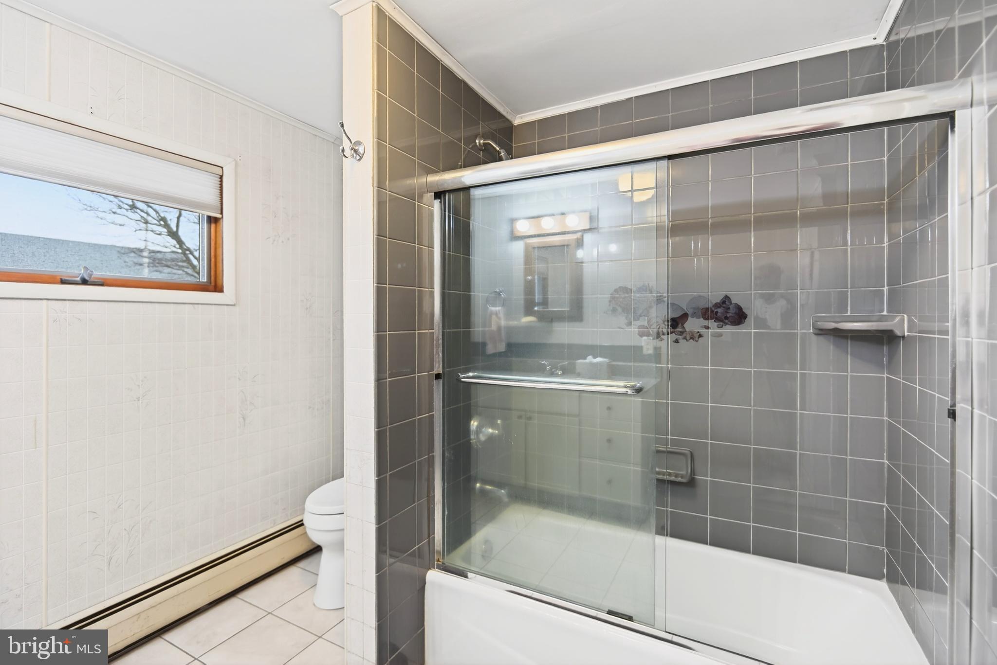 4 Rona Lane Manahawkin, NJ 08050 - Photo 26 of 28 a bathroom with a bathtub