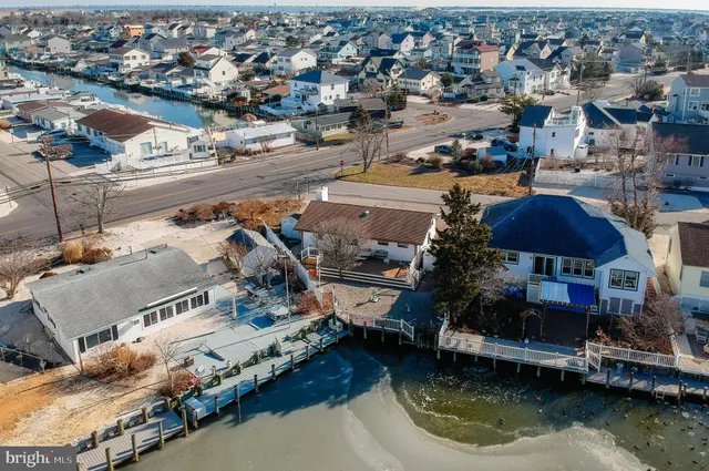 an aerial view of a house with a lake view