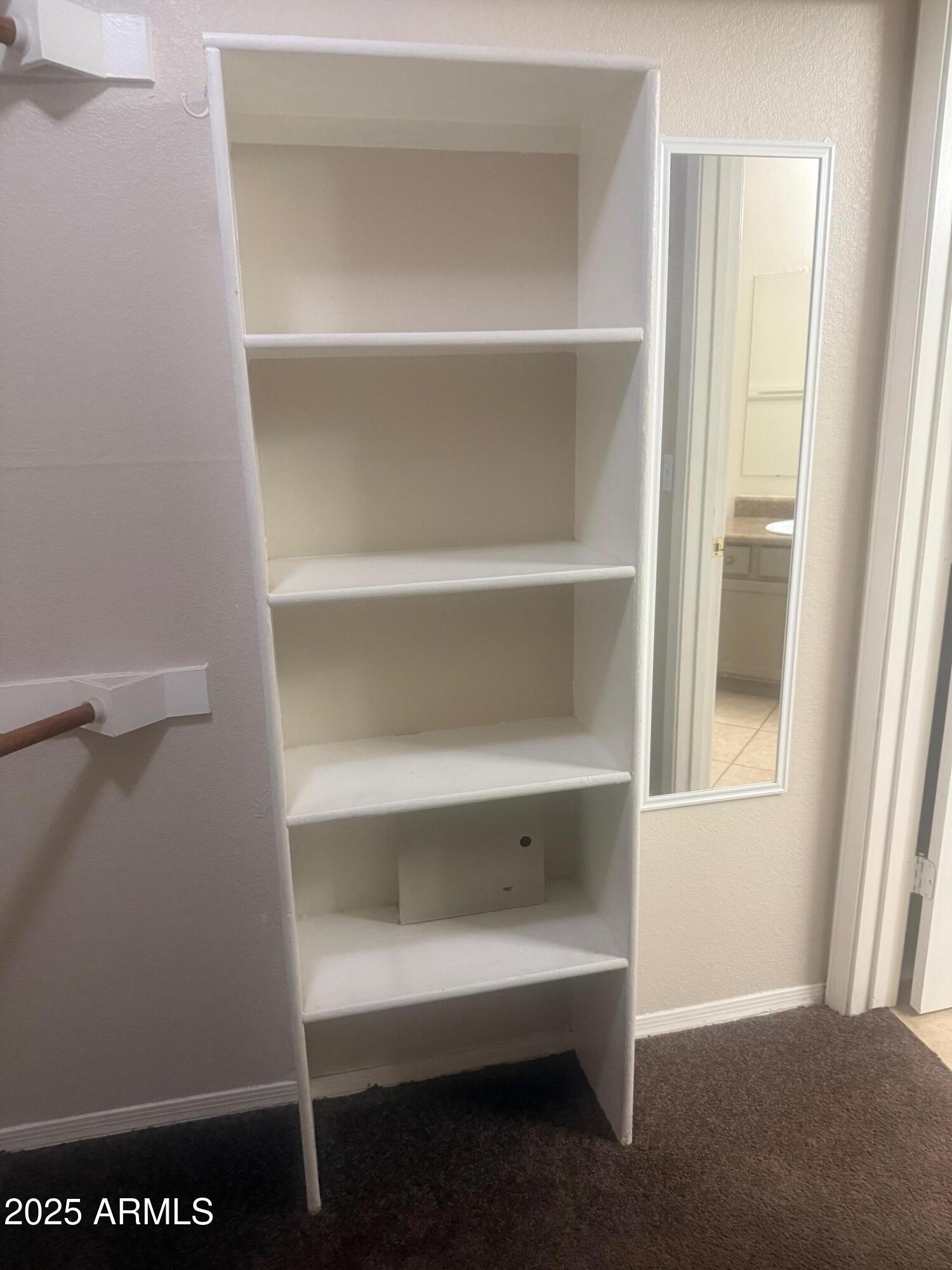 3848 North 3rd Avenue, Unit 2071 Phoenix, AZ 85013 - Photo 24 of 31 a view of an empty walk in closet