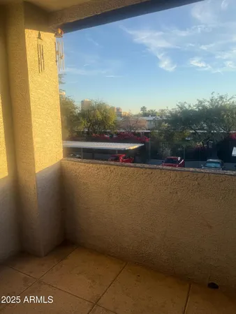 a view of balcony with furniture