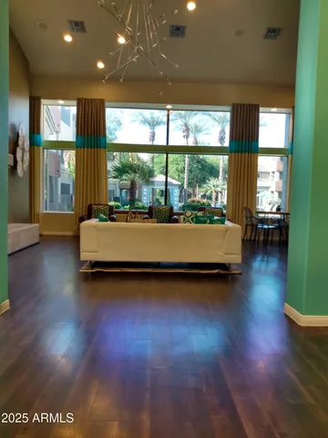 a living room with couch and a large window