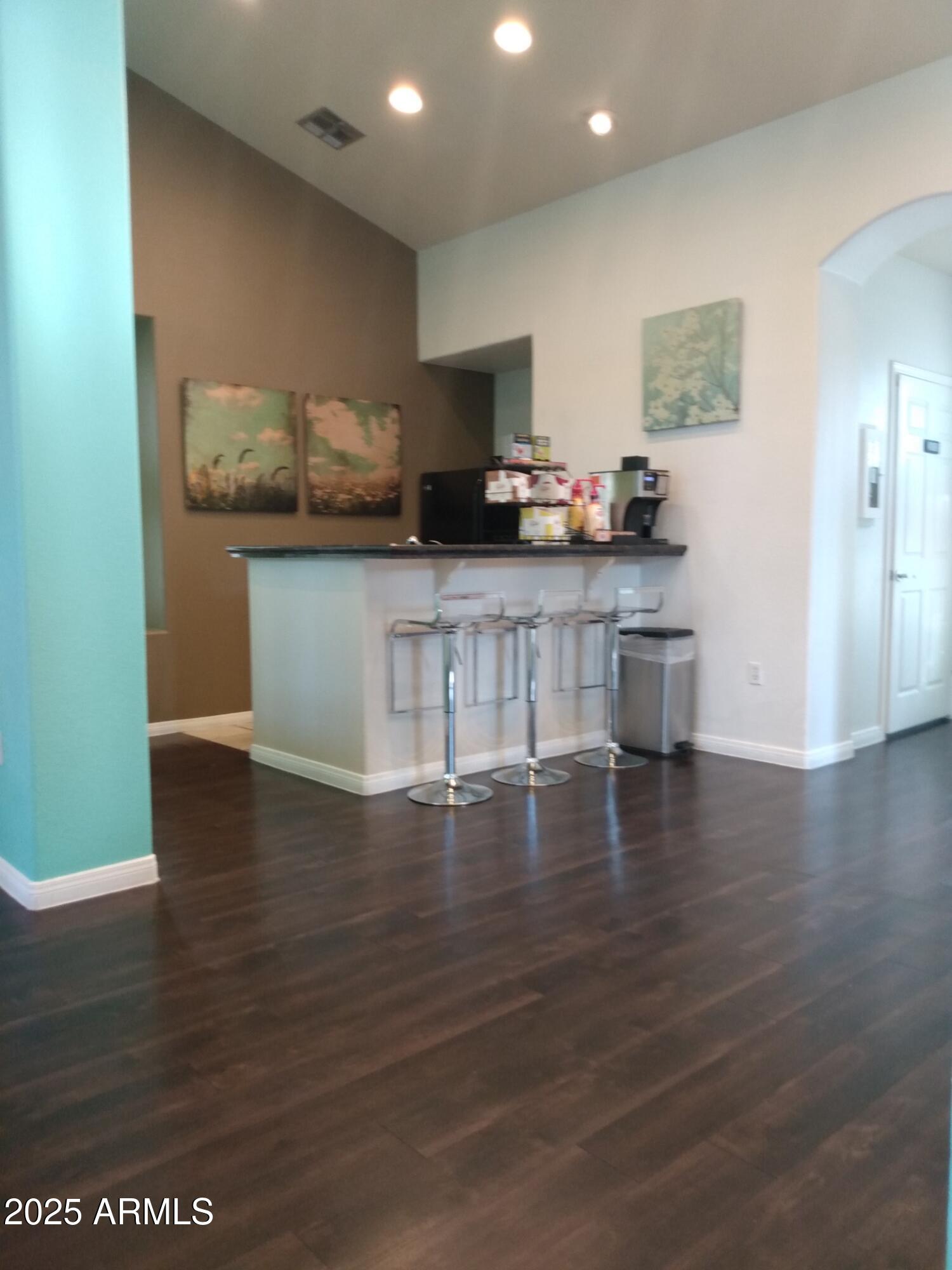 3848 North 3rd Avenue, Unit 2071 Phoenix, AZ 85013 - Photo 5 of 31 a kitchen with stainless steel appliances wooden floor and a counter top space