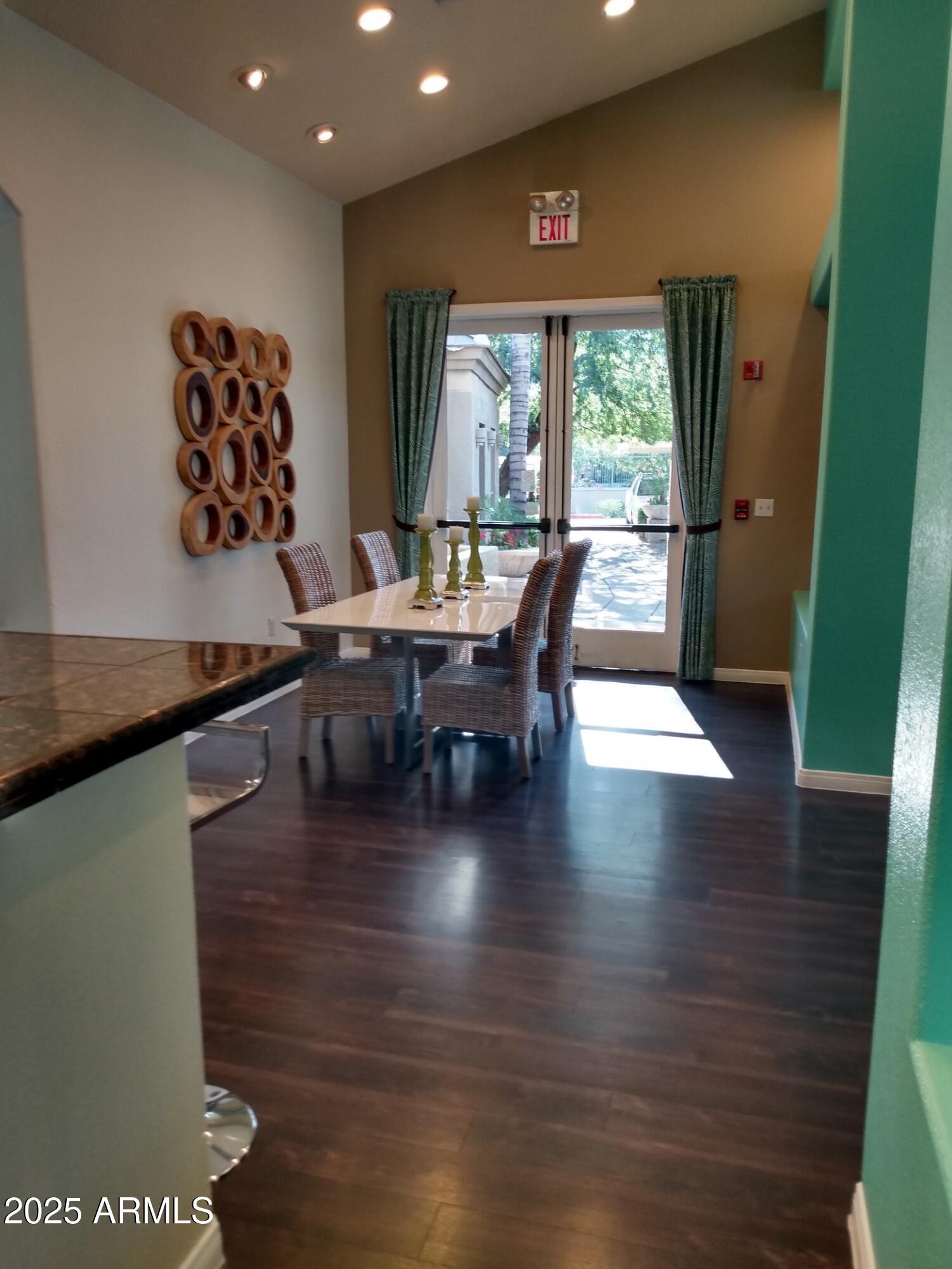 3848 North 3rd Avenue, Unit 2071 Phoenix, AZ 85013 - Photo 6 of 31 a view of a dining room with furniture window and wooden floor