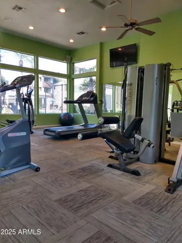 a living room with gym equipment