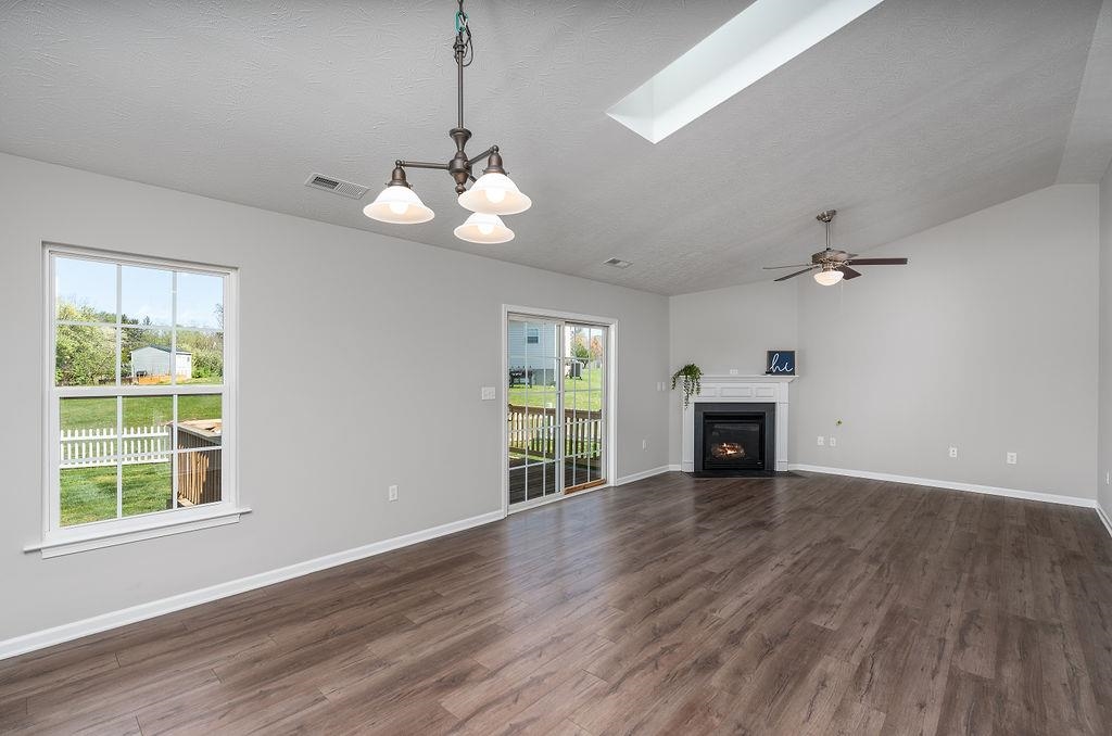 220 Inglecress Road Waynesboro, VA 22980 - Photo 8 of 46 a view of an empty room with a window and wooden floor