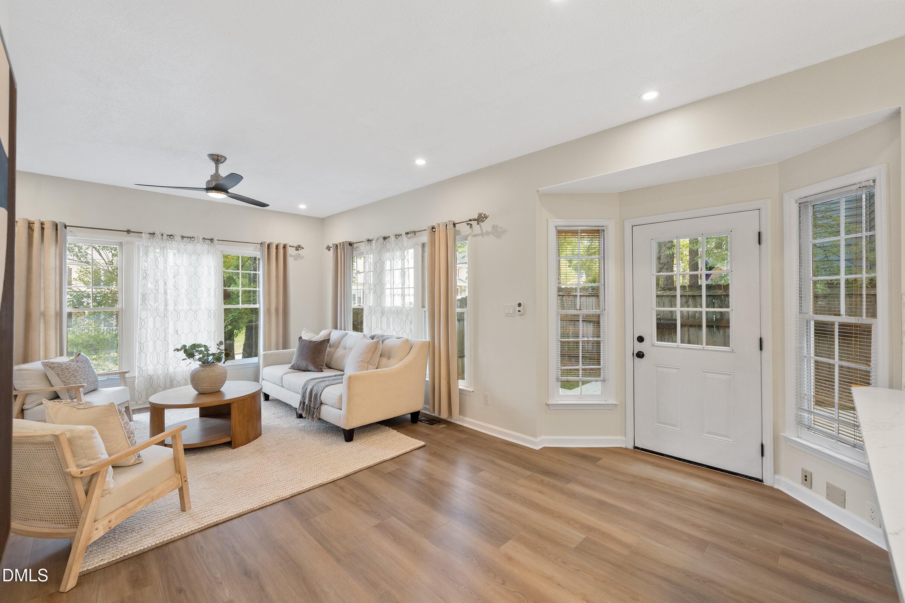 2517 Birchford Court Raleigh, NC 27604 - Photo 26 of 63 a living room with furniture and large windows