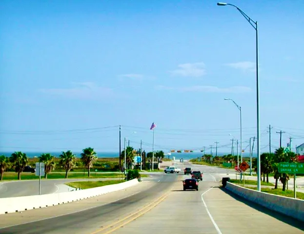 a view of a park with bench and trees