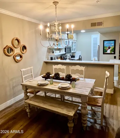 a dining room with furniture and window