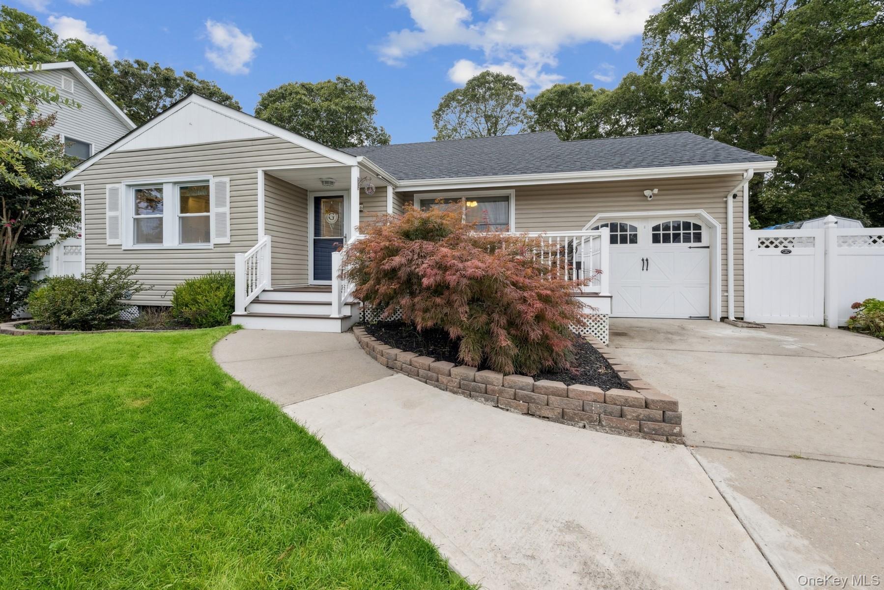 16 Larry Road Selden, NY 11784 - Photo 1 of 1 View of front of house with an attached garage, a shingled roof, and concrete driveway