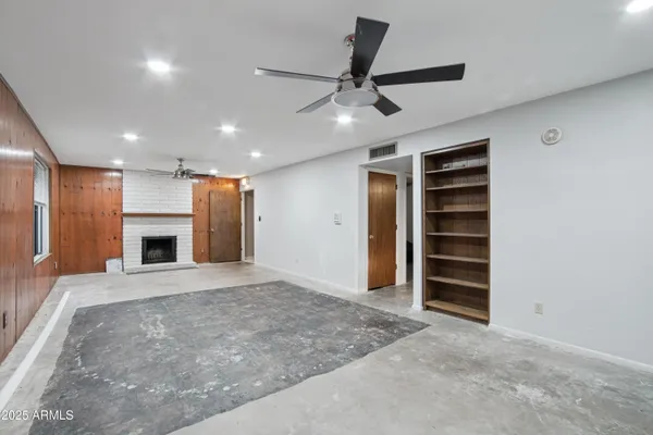 a wooden bench sitting in middle of a backyard