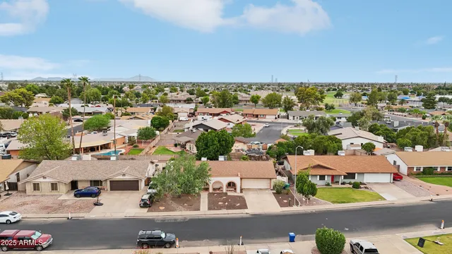 an aerial view of residential houses with outdoor space