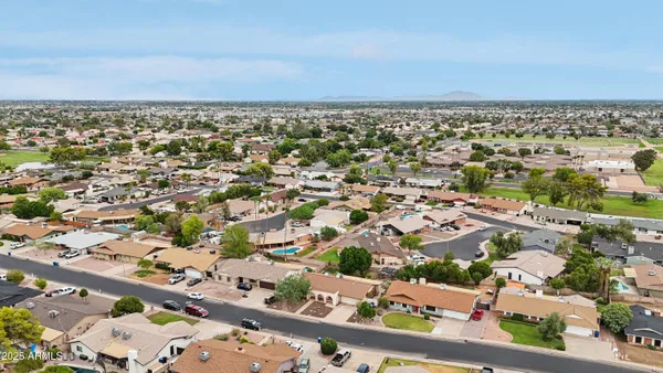 an aerial view of residential houses with outdoor space
