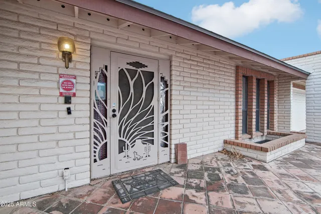 a front view of a house with parking space