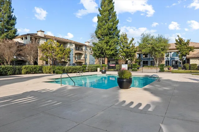 a view of a park with swings and slides