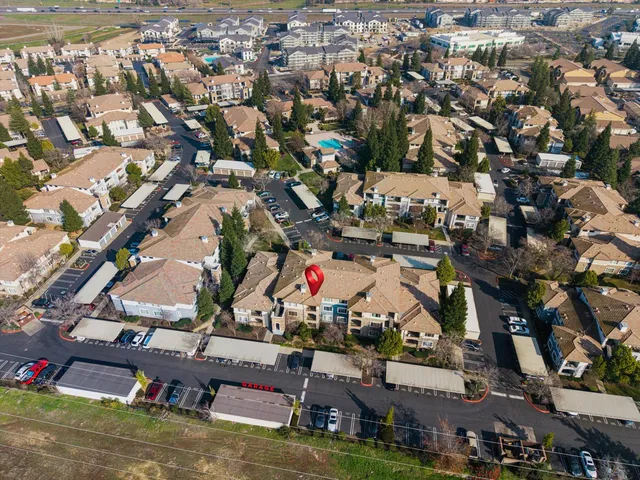an aerial view of residential houses with outdoor space