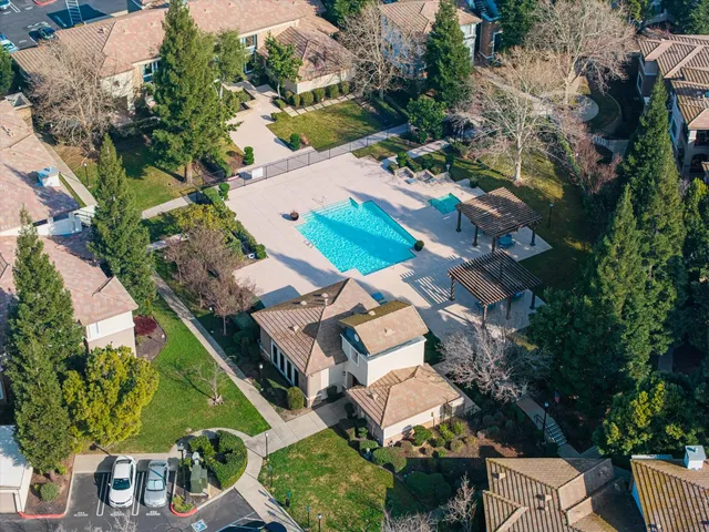 an aerial view of a house with a yard