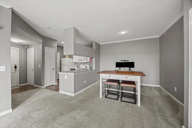 a kitchen with a table and chairs in it