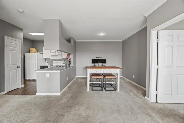 a kitchen with a sink and a refrigerator